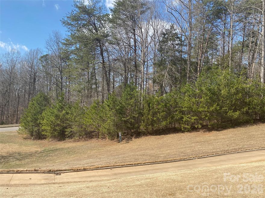 Great lot in Rock Barn Country Club and Spa. Beautiful views of the Robert Trent Jones Jr course. Min 2500sq ft-1 level and 3000 min 1 1/2 to 2 story. 2 golf courses, 1st class Spa, Equestrian center, 4 rest,  8 tennis courts, pickle ball, fitness center.