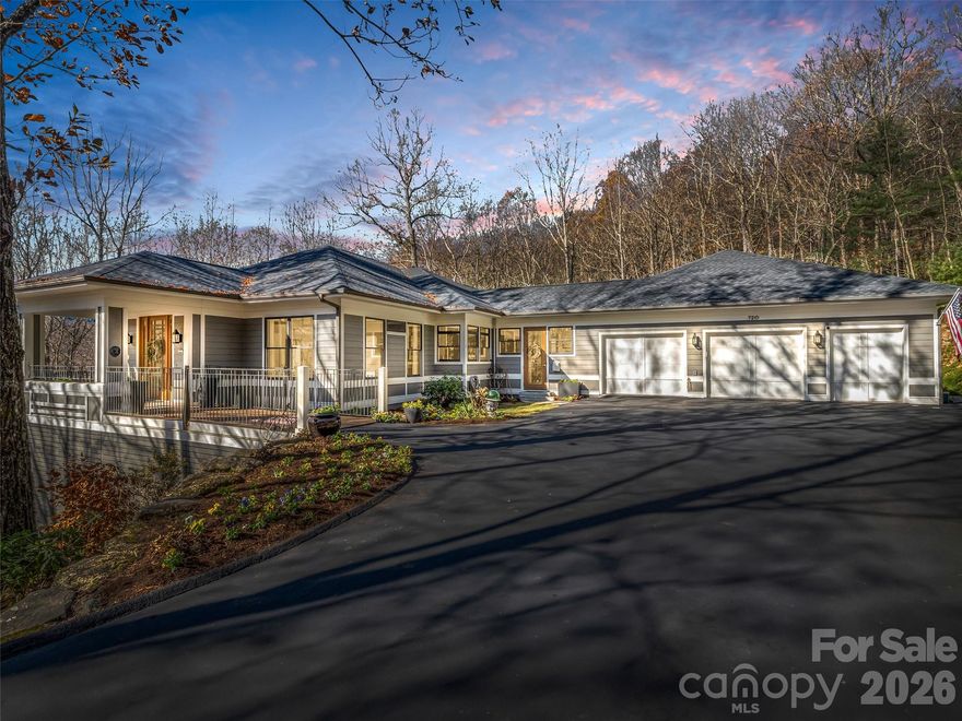 Privately nestled on over an acre in one of Flat Rock’s most desirable private golf communities, this stunning custom home offers approximately 4,400+ square feet, 4 bedrooms, and 4 baths—blending refined craftsmanship with elevated mountain living.
From the moment you arrive down the long, flat driveway (a rare feature in the mountains), you're welcomed by mature hardwoods, natural landscaping, and a sense of quiet sophistication.
Step through the front door into the bright and open living room where two sets of expansive corner windows flood the space with natural light, perfectly framing the wooded surroundings. A freestanding gas fireplace anchors the room, while seamless access to a large covered balcony creates an effortless indoor-outdoor flow—ideal for entertaining or simply enjoying the peaceful setting.
The gourmet kitchen is both functional and well-appointed, designed with entertaining in mind. Warm wood cabinetry, quartz countertops, a classic subway tile backsplash, and a spacious breakfast bar are complemented by premium appliances including a 48" Sub-Zero refrigerator/freezer, a professional six-burner Wolf gas range with double wall ovens and Pro island hood, plus a Bosch dishwasher and built-in ice maker. The kitchen connects seamlessly to the dining area, creating a cohesive and inviting gathering space.
The main-level primary suite serves as a serene retreat, featuring a sunlit bonus sitting area, a custom walk-in closet, and a newly renovated spa-like bath with heated floors. Thoughtfully designed for comfort and privacy, this space captures the essence of relaxed luxury.
The lower level expands the home’s versatility with a large open flex space, perfect for recreation or lounging, along with two guest bedrooms—each with its own en suite bath and walk-in closet. A dedicated home theater equipped for modern streaming and connectivity offers an elevated entertainment experience.
Outdoor living is equally impressive, with two expansive covered terraces designed for year-round enjoyment of the mild mountain climate. Whether hosting guests or unwinding in nature, these spaces provide a true extension of the home.
Completing the property is a spacious two-plus car garage with a dedicated golf cart bay and workshop area, offering both practicality and flexibility.
Located just minutes from the Kenmure Clubhouse, dining, golf, fitness center, pools, and tennis courts, this home delivers a rare combination of privacy, convenience, and timeless mountain elegance.