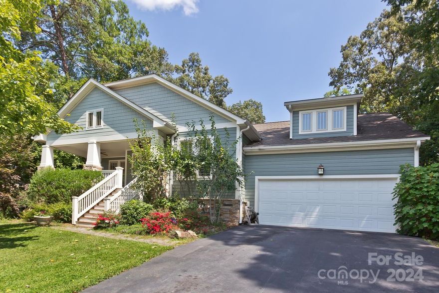 Welcome to Biltmore Lake, this home is 2 blocks from the lake trails & amenities! Beautifully updated, 4-bedroom, (3 are en-suite) home site elevated above the road with mature trees and landscaping. Welcoming, deep covered front porch with views to the mountains offers abundant outdoor living. The arrival
experience starts at the front porch and continues into the foyer from which
the strength of the open floor plan is evident. Light-filled, home with newly refinished oak floors throughout the home. Light-filled, open floorplan has newly refinished oak flooring throughout! A large chef’s
kitchen with an island that seats 4 comfortably and has updates (2023) 
new custom soft close cabinetry, handcrafted walnut floating shelves, honed
black granite. The main floor has two additional bedrooms. One just off the
kitchen, has been used as a mother-in-law suite
Upstairs bonus room/bedroom with/full bathroom, 
attic storage. Lots of closets, pantry storage, with an oversized Garage.