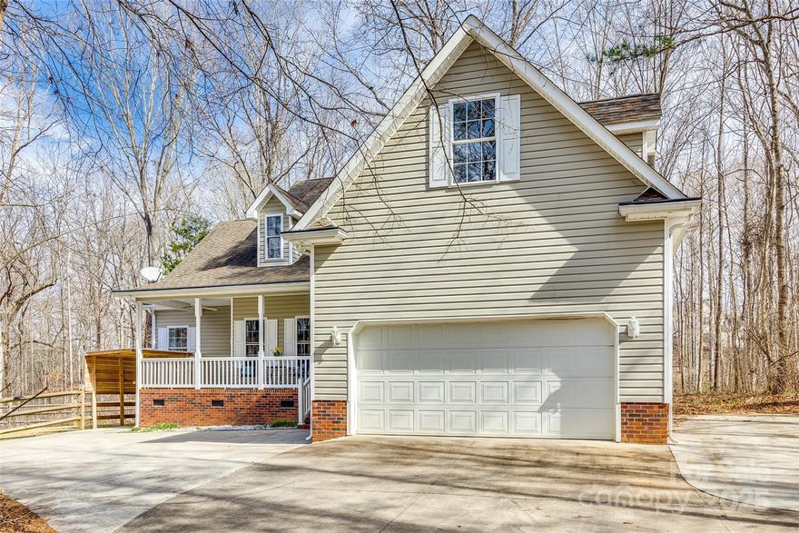 Rocking chair front porch, country charm, nestled on over 1.25 acres w/ NO HOA?! You've found it! At entry you'll be welcomed by beautiful hardwoods that flow through the living spaces of the entire main level. This spacious layout offers a formal dining room, vaulted living room ceilings, a cozy fireplace, & laundry room w/ built-in storage. Your open kitchen w/ granite countertops, bar seating, & breakfast area provide plenty of room for prep & entertaining. Enjoy a split floor plan, upper level bonus room, & a primary bedroom fit for relaxation w/ tray ceilings & separate sitting area. The primary ensuite offers dual sinks, a garden tub, & a separate walk-in shower. Head out to the private back deck overlooking peaceful wooded views, a generously sized & partially fenced side yard, & expanded driveway. Added bonus- HVAC & Plumbing are just a few years young! Zoned for award-winning Clover Schools, & conveniently located to shopping, dining, downtown York, & Lake Wylie! Welcome Home!