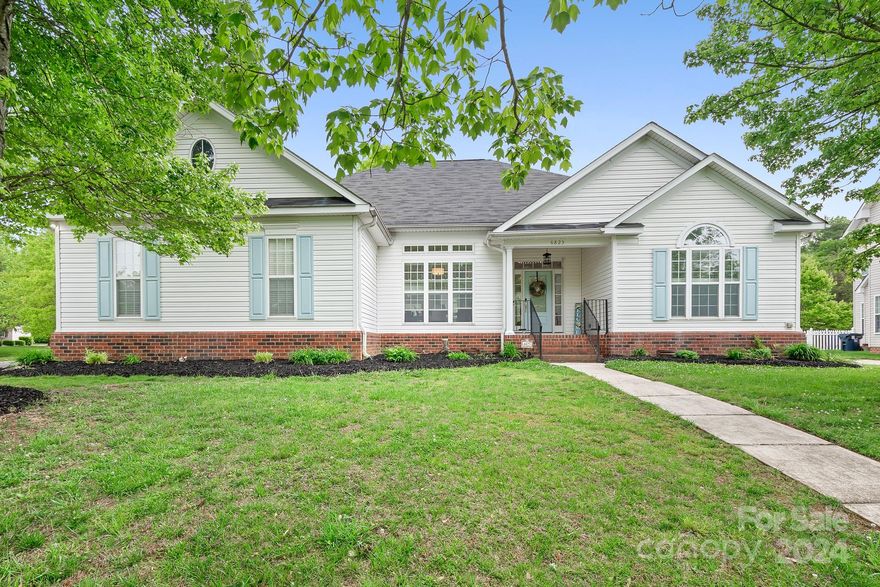Newly updated ranch styled corner lot home featuring 3-bedrooms with optional 4th bedroom or office, 3 full and 1 half baths! Open floor plan is perfect for modern living, stay connected with Wi-Fi-enabled ceiling fans and AC controls. The blue porcelain center island is fitted with dishwasher, farm sink paired with a luxe gold gooseneck faucet, drum lighting, finished with under-counter microwave and storage. Formal dining area and eat-in kitchen offers plentiful natural lighting. Cozy up by the dual fireplaces, located in both the living room and adjacent sunroom, perfect for chilly evenings or intimate gatherings. Fresh modern flooring throughout the home.
Primary bedroom with tray ceilings dual closets leading to the primary bath featuring free standing tub, spacious shower, dual sinks and a backlit full-length mirror for added elegance and relaxation. Enjoy a spacious backyard with a new deck with built-in seating. Ask about adding a privacy fence. Seller is installing new HVAC.