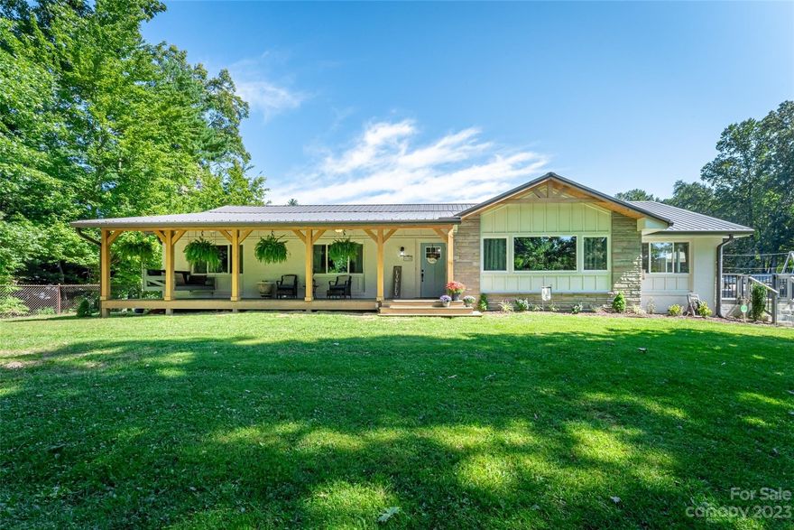 MOTIVATED SELLERS! This private modern farmhouse features a newly renovated kitchen with a walk-in pantry, soft-close cabinets and drawers, Quartz countertops and beautiful tile backsplash. The family room is spacious with an abundance of natural light and cathedral ceiling. A lavish lower level boasts a fantastic family room that is over 700 sq ft PLUS a fully functional kitchenette and fully bathroom. Under deck roofing installed to protect vehicles from weather. This home enjoys extensive outdoor entertaining areas, including an above-ground pool and fire-pit.  Just a few miles from downtown Hendersonville, I-26, Burnshirt Winery, Chimney Rock, Lake Lure, shopping, eateries, and more!