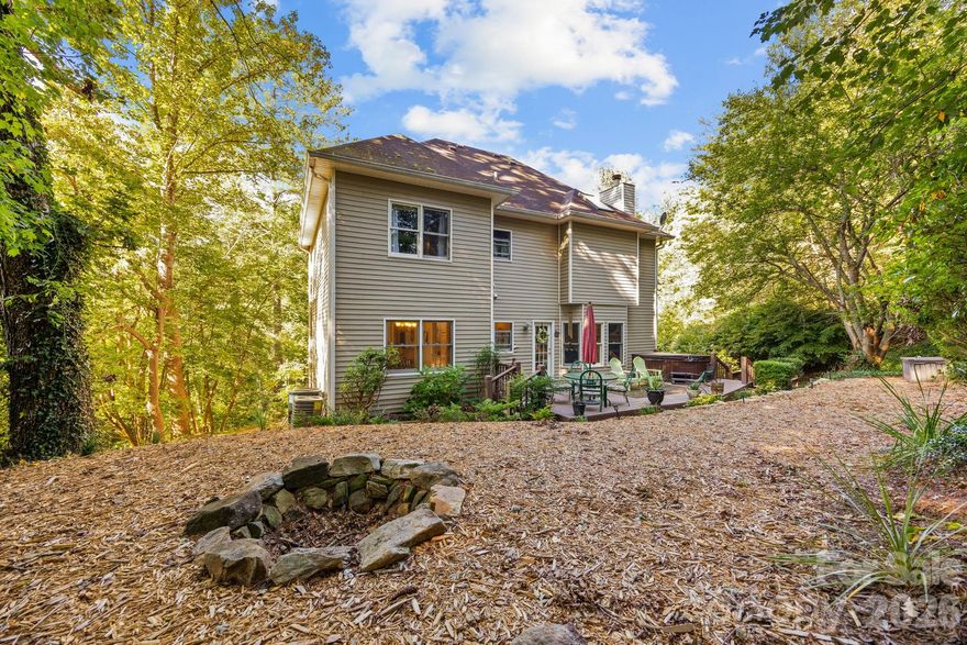 $10,000 CASH AT CLOSING for carpet, roofing, rate buy-down, whatever! This is an AWESOME, freshly painted and spacious home in HAW CREEK – without an HOA! Nestled in the scenic and super-convenient Haw Creek Valley, this expansive home offers an ideal setting for a growing family. Enjoy a generous kitchen with ample storage, a luxurious primary suite with an oversized bath, and a total of four spacious bedrooms. The main level features a large living room, and separate den or office space flooded with beautiful natural light during the day, perfect for work or play. Venture down to the basement, where you'll find versatile finished space complete WITH A FULL BATH, providing endless options, and a spacious garage, workshop. Step outside to discover plenty of outdoor space, ideal for entertaining or relaxing in your private oasis. Don’t miss the chance to make this beautiful property your own!   Experience the perfect blend of convenience and tranquility in Haw Creek! Just a 5-minute drive to Haw Creek School and Evergreen Charter School, 10 minutes to Whole Foods, and less than 15 minutes to the vibrant heart of Downtown Asheville, you'll enjoy all the perks of city living while retreating to your serene countryside oasis. Embrace a lifestyle that offers both ease and escape! Schedule your showing right away! 14 month HOME WARRANTY included! MOTIVATED SELLER!