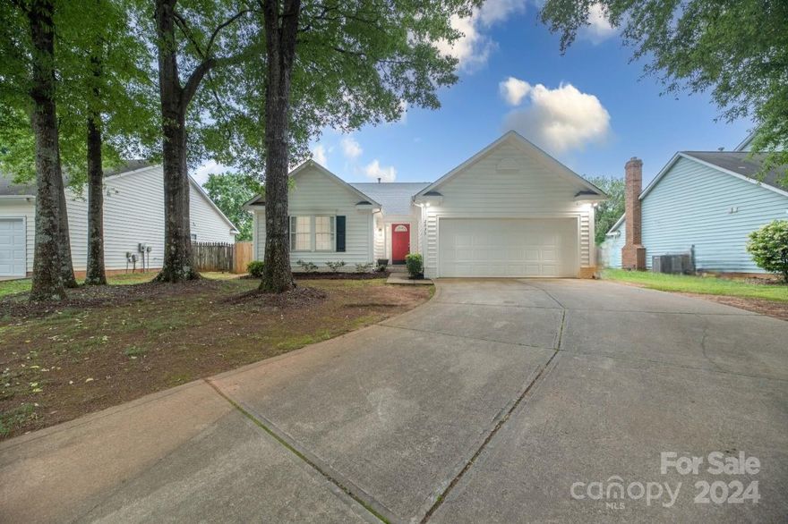 Enjoy this ranch-style home with many great features. 3 beds, 2 baths, spacious 2-car garage, this home offers 1525 sq ft! Step inside and notice the open, easy flowing floor plan and high ceilings in the main living area making the home feel airy! The kitchen features a contemporary design, featuring light white cabinets, sleek countertops, and all stainless steel appliances that convey. NEW FRIDGE! Carpeted bedrooms. Primary bedroom offers walk in closet, and en-suite with tub and glass walk in shower! Sliding glass doors lead you to the spacious backyard, where you'll discover a NEW full privacy fence, lush green grass, & a patio great for enjoying this beautiful backyard. Convenient location - 15 mins to Uptown Charlotte, 20 mins to Charlotte Douglas International Airport, 6 mins to I-85, 9 mins to I-77! Close proximity to stores for your daily needs, shopping, restaurants, and grocery! 2023 Roof, Various New Windows, 1-2 Year Old Hot Water Heater.