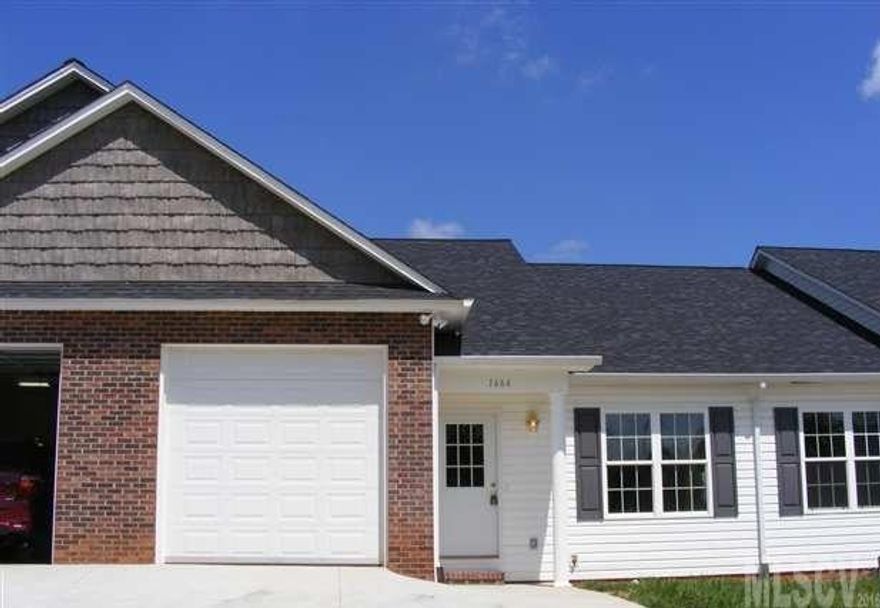 One level 2 bed 2 bath townhome with laminate hardwood flooring, single car garage, deck, $90 a month hoa dues