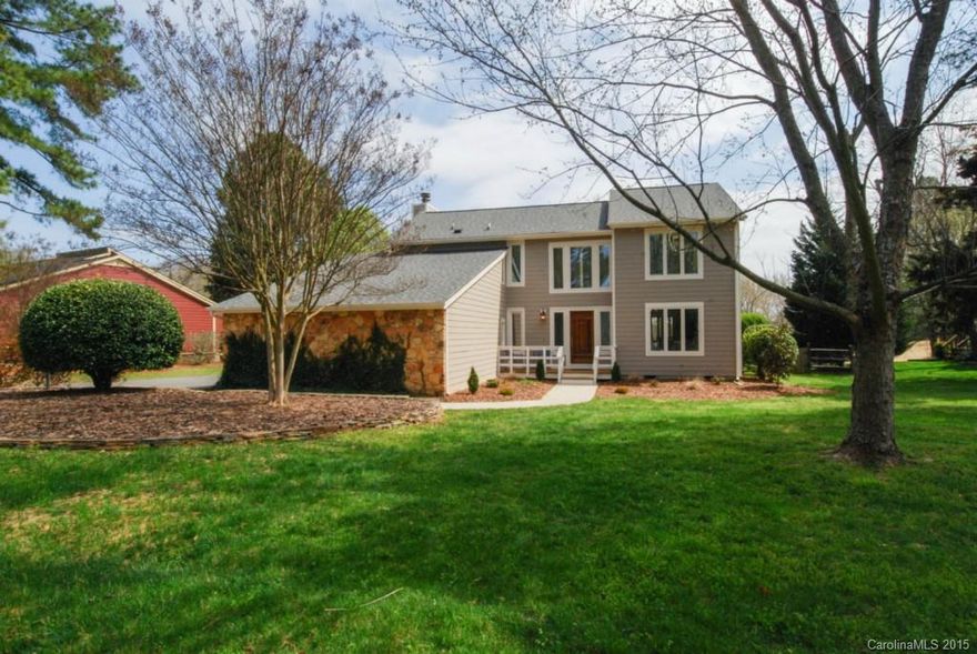 Gorgeous Home on the #1 green which you can view from the covered porch or upstairs terrace!  New Hardboard Siding, New roof in 2011, New water heater, fresh interior paint, new sliding glass doors, newer upgraded carpeting, new landscaping!  Master Bedroom is huge, Master Bath is updated with tile and granite. Wonderful stone fireplace in den with gas logs, great reading nook on upstairs landing plus 3 large bedrooms.  Wonderful floor plan for entertaining, fenced back yard and move-in ready!