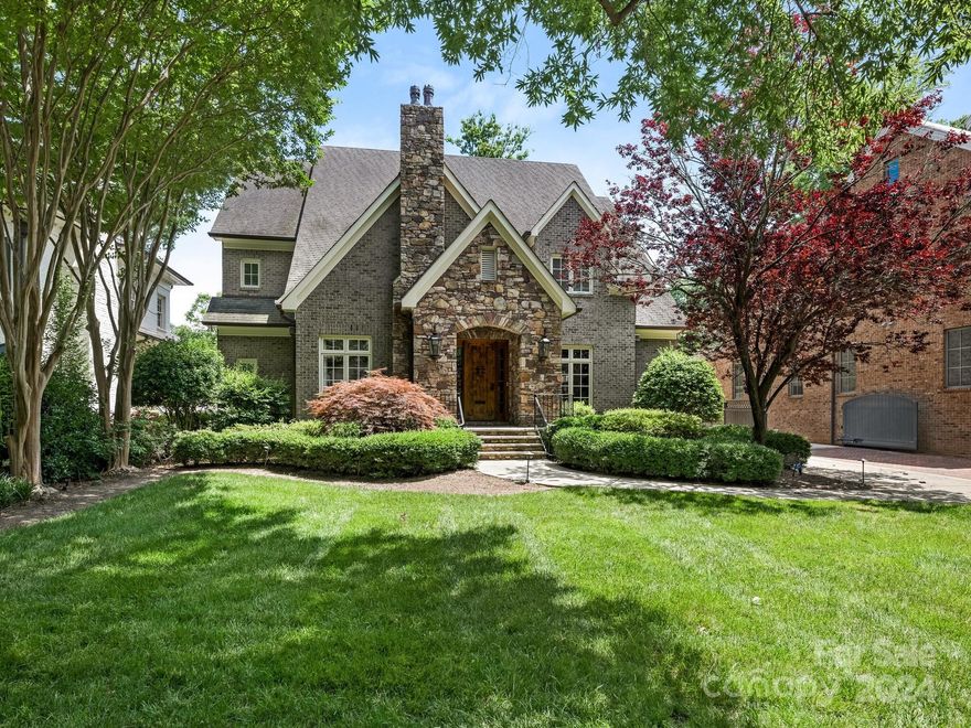 Charming Myers Park home on a tranquil street. This custom residence has a floor plan ideal for both entertaining and everyday living. At its heart, a centralized great room seamlessly connects to a bright, airy sunroom. Fireplaces enhance the great room, sunroom, and study. The spacious gourmet kitchen features a walk-in pantry and an adjoining breakfast room. A formal dining room for entertaining. The primary suite is on the main floor and has direct access to the sunroom. The second floor offers three bedrooms, three full baths, and a bonus room. Outside, enjoy a private backyard with a stone patio.  Located in the heart of Myers Park, this home is minutes from uptown Charlotte, restaurants, and shopping and is within walking distance of Freedom Park.