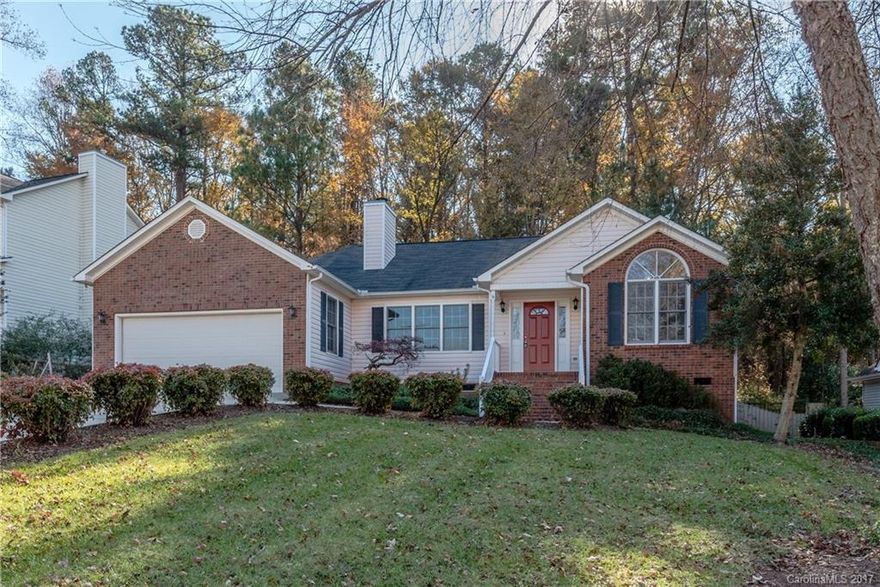 This adorable ranch is move-in ready, minutes from shopping, and close to I-77.  Home features include gleaming, refinished hardwood floors in great room & kitchen, new carpet in all bedrooms, and freshly painted interior.  Vaulted ceilings & Gas Log Fireplace in Great Room. Kitchen boasts new granite counters. New tile has been installed in master bathroom and laundry.  Home has in-ground irrigation & mature landscaping.  Enjoy the privacy of your wooded, fenced backyard from your lovely deck.