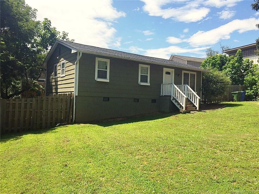 Walkable West Asheville with a yard!  Sweet rancher - must see to appreciate.  If you are looking for that special spot in the West Asheville neighborhood - this is it. Located on a dead end street- truly an amazing home that has all the upgrades on your wish list.  Gourmet kitchen with stainless steel Maytag appliances, granite countertops with tile backsplash, crown molding, fully fenced yard, stylish lighting, and a slate shower all add up to a true treasure.