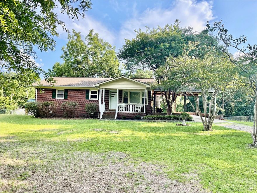 Cozy brick ranch is too adorable and move-in ready! Kitchen updated with granite counters, tiled backsplash, and vinyl plank flooring. Bath updated with granite vanity and walk in shower. Bedrooms have fresh paint and new carpet. The living room has laminate floors and a gas log fireplace. The home sits on a half acre corner lot in the Forest Lakes neighborhood, has an attached carport and circular drive. There is another metal carport in the back yard. The ideal location for commuters to either Charlotte or Columbia, you are minutes to I77. Great Falls is home to all sorts of outdoor activities such as Carolina Adventure World, Rocky Creek Sporting Clays, Lake Wateree, Gallo Winery and the new Whitewater Center. Great for investors too!