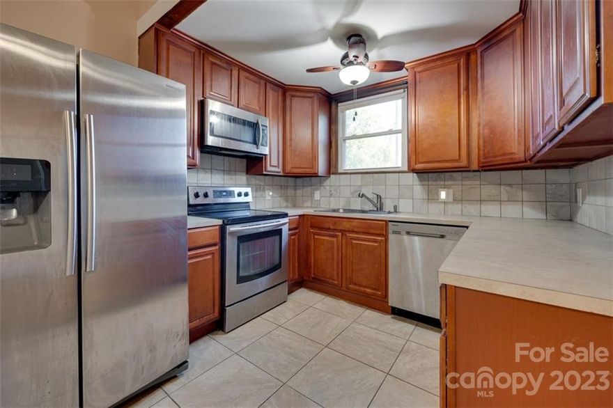 Spacious bungalow with large bedrooms and a remolded kitchen in 2016 with 42-inch cherry wood cabinets. Newer bathroom with a deep tub, a fenced yard, and ample parking in the driveway. New HVAC in 2020, 100% of electric and plumbing, including all the drains from the house to the sewer line in the road.