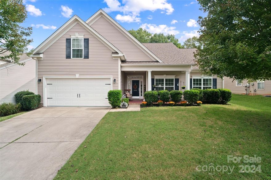 Filled with natural light and charm, this 4 bed/2 full bath house is calling you home! Decorate for the holidays or enjoy sipping a sweet tea on the welcoming front porch to this lovely residence. Primary bedroom on main, features a walk-in closet and spa-like en suite bathroom. The laundry is conveniently located on the first floor between the 3 main-floor bedrooms and washer and dryer will convey. A spacious living room looks out to your ultra private rear yard and enjoy comfortable nights on your screened porch. The second floor houses a great-sized bonus room or 4th bedroom, with endless possibilities and exceptional storage. Water heater replaced in 2020. This home features no carpeting and is a blank slate for someone with allergies. This home has been meticulously maintained and loved. Community features include pool and playground, as well as the perfect Indian Land location. Close to restaurants and shopping, easy access to Ballantyne, Fort Mill and Charlotte.