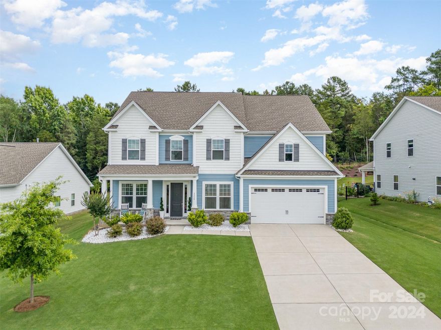 Welcome to Prestwick, a Gated community in an exceptional location in Indian Land, SC. This stunning home offers over 4,400 sq ft of luxurious living space across three stories that back up to Sugar Creek Greenway for the ultimate wooded view. 10 ft ceilings and 8 ft doors on the first floor create an airy, open feel.  Designed for comfort and style. The custom kitchen is a chef's delight-wall micro/oven combo, farmhouse sink, pullout drawers in cabinets, and more.
The primary retreat offers a sitting room and his and hers closets.  Natural light floods the home highlighting the beautiful interior spaces. Step outside to a private wooded backyard, offering tranquility and a perfect backdrop for outdoor entertaining.
Additional features...tech center, dedicated office space, Jack and Jill bath, and an ensuite.  This home has everything you need for a contemporary, comfortable lifestyle in a secure, serene environment at an incredible value compared to the market.