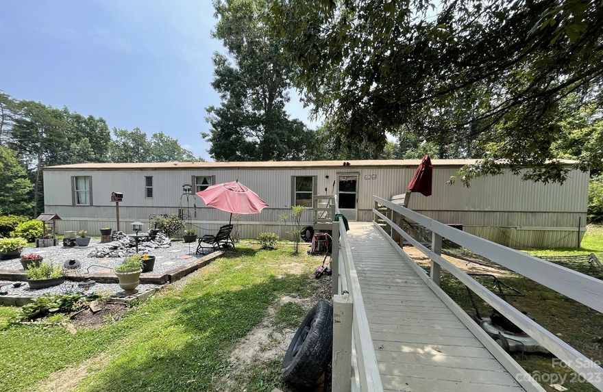 Single wide mobile home on private 1.1 acre lot in the country. With a little TLC, this could be the perfect place for you. The lot is clear, level with a mild slop on left side, and mature trees surrounding the property lines for added privacy. Beautiful sitting area in the front with pond installed. Sit and listen to the running water while enjoying the quite outdoors. Seller has done some updates in the home, it's waiting for someone to give the final touches. BEING SOLD AS IS. Seller will not make any repairs.