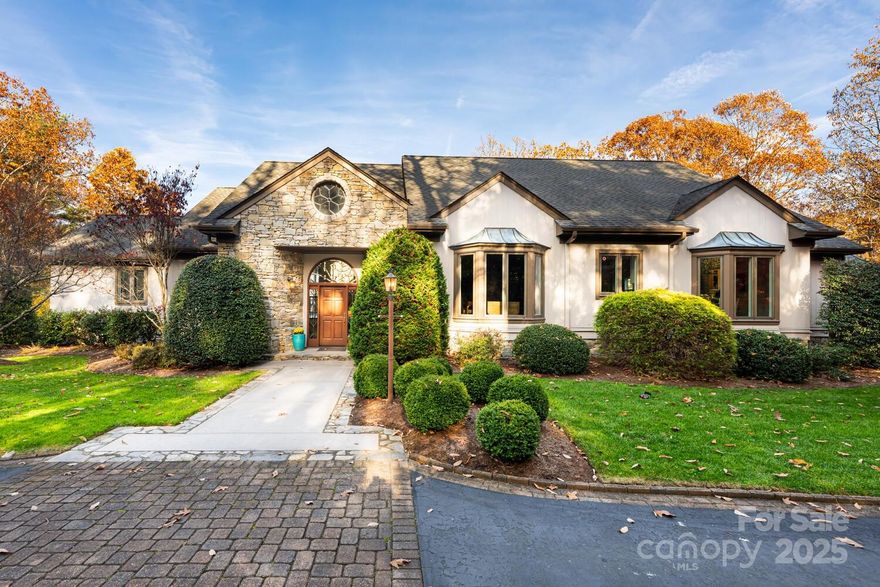 The Epitome of Luxury Mountain Living with majestic, panoramic views! Experience refined mountain living at its finest in this extraordinary home perfectly positioned on 1.8 acres of gorgeously landscaped privacy within prestigious Kenmure-a gated golf course community. Designed to capture breathtaking multi long range mountain views, this exceptional residence showcases uncompromising quality and timeless design throughout. The main level boasts over 3300 Sqft of open-concept living with expansive wall of windows framing the endless mountain vistas. The magnificent great room features a cathedral tongue and groove ceiling with beams, a floor to ceiling stone gas fireplace and seamless access to the spacious deck. The professional gourmet kitchen is a true showpiece-ideal for both entertaining and culinary artistry-boasting an abundance of custom cabinetry with pull-outs, drawers, elegant leathered quartzite countertops and tile backsplash, a grand center island with gas cooktop and prep sink, breakfast bar and top-of-the-line Wolf appliances, two dishwashers and Sub-Zero refrigerator/freezer, wine bar with 2 beverage/wine refrigerators, unbelievable storage areas and every amenity imaginable along with a breakfast area. The dining room with bay window complements the inviting living room which features a vaulted ceiling with wall of windows enhancing the views, marble surround gas fireplace and sliders opening to deck. The luxurious primary suite is a private retreat featuring spectacular mountain views, two walk-in closets and a spa-like bath with heated tile floors, dual vanities, whirlpool tub and a tiled walk-in shower with multi-sprays. A beautiful study with built-in desk and cabinets, a full bath and spacious laundry with cabinetry and sink complete the main level. The lower level offers exceptional versatility with a large family room and recreation area, wet bar, hobby room, 2 guest bedrooms with walk-in closet, full bath, half bath and a substantial unfinished area perfect for storage or workshop. Outdoor living is equally impressive with an expansive main level open and covered deck and a lower terrace- all oriented to capture the awe-inspiring mountain panorama. A three car detached garage with covered breezeway completes this rare offering. Every room in this home is designed to embrace the spectacular views and natural light, blending elegance, comfort and mountain serenity in perfect harmony. Discover a one-of-a-kind property offering the ultimate in luxury, privacy and timeless beauty- a rare opportunity in one of Western NC’s most sought after gated communities.