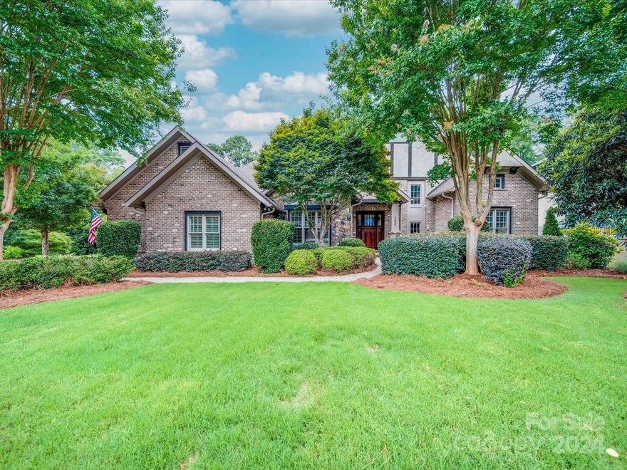 This home is located in The Palisades Ashton Oaks neighborhood, a prestigious gated community featuring upscale homes like this custom craftsman style home. You enter into a vaulted wood beamed family room containing one of the four fireplaces in this home. There are custom features throughout including heated primary bathroom floors, circulating hot water, a movie room and wainscoting in the dining area, throughout the basement family and game room and even in the large three car garage. The large primary bedroom offers high trey ceilings and large windows overlooking the 18th hole of the golf course. Hardwood floors cover much of the main floor and a large porch extends across most of the main floor with stunning views of the golf course,the inground pool and lushly landscaped backyard. The large basement has a large spacious room with a fireplace, full kitchen and a game room with several French doors leading to a large covered porch, pool and professionally landscaped private yard.