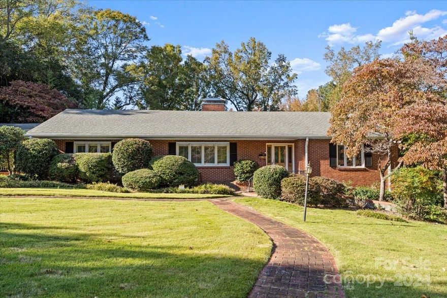 Welcome to this solid brick 4 bdrm, 3 bath home nestled on a picturesque 1.46 acre corner lot in Lancaster’s highly sought-after Sunny Hills n'hood. Lovingly maintained by the same family since built this home exudes timeless character & warmth. The sunroom w/ its knotty pine paneling & brick floor offers serene views of the beautiful yard complete w/ a stamped patio, inground pool & expansive concrete decking—a perfect spot to relax or entertain. Spacious living areas including a large formal LR/DR w/ plantation shutters, cozy den & 2 fireplaces! Original hdwd flrs are in excellent condition & the kitchen boasts solid surface counters, SS appliances & an open layout that flows seamlessly into the den & sunroom. With ample built-ins for storage this home offers both charm & functionality. Conveniently located near MUSC Lancaster Hospital, USC-L, Main Street, shopping, dining & just steps from The Lindsay Pettus Greenway. Your perfect Lancaster home awaits you! HVAC 2013, H20 htr 2022.