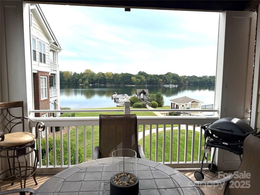 Enjoy lake living in this Spinnaker Point end unit condo on Lake Davidson, complete with a boat slip and a 20 foot pontoon boat! Million Dollar views can be seen from the living area, kitchen and the primary bedroom.  Plantation shutters and new LVP throughout most of the condo.  The open floor plan has a fireplace, built-ins and a kitchen bar area.  The primary bedroom has deck access and a custom walk in closet.  There is additional storage room just outside the condo.  The community offers lake access, kayak and paddle board launch, swimming pool and tennis courts. 
Condo is Unit #20, on second floor of Building 2.
Deeded boat slip included and the 20 foot pontoon boat.
