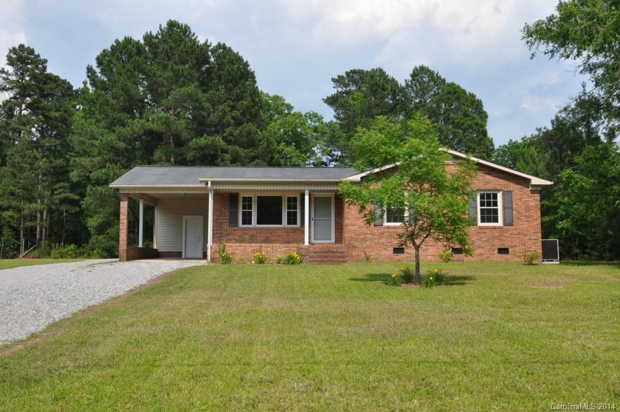 Beautiful 3br, 2bth remodeled brick ranch in Lancaster SC area! Remodeled and move-in ready. Fresh designer paint. New kitchen...check out the cabinets! New sliding door to 12x16 deck. New vinyl windows! Tiled kitchen. Gorgeous hardwd floors! Two bathrooms.  Spacious MBR retreat. MBR bath has walk-in shower. Carport & utility room. Incredible detached 24x20 wired workshop.  Backyard perfect for gardening & relaxing. 100% financing USDA loan eligible area! Take a tour of this showcase home today!