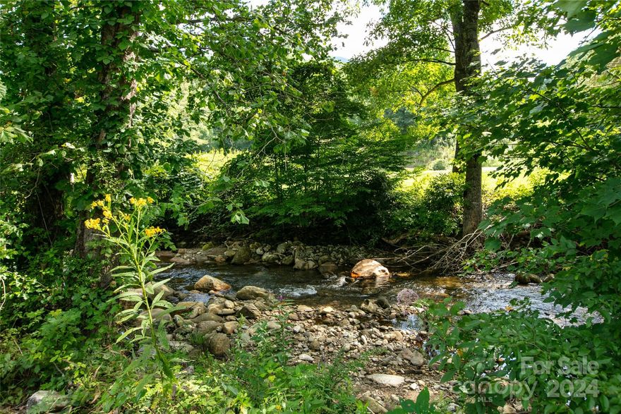 Ready to Build Your Mountain Retreat by the River? Discover a well-maintained and near-level community—a rare gem in the mountains! Immerse yourself in the soothing sounds of water cascading over river rocks, set against the breathtaking backdrop of the national forest and Camp Daniel Boone. Enjoy convenient access to the Blue Ridge Parkway, renowned trout waters perfect for fly fishing, and the locally beloved Sunburst Trout Farm. Whether you're seeking tranquility or adventure, this location offers the best of both worlds.