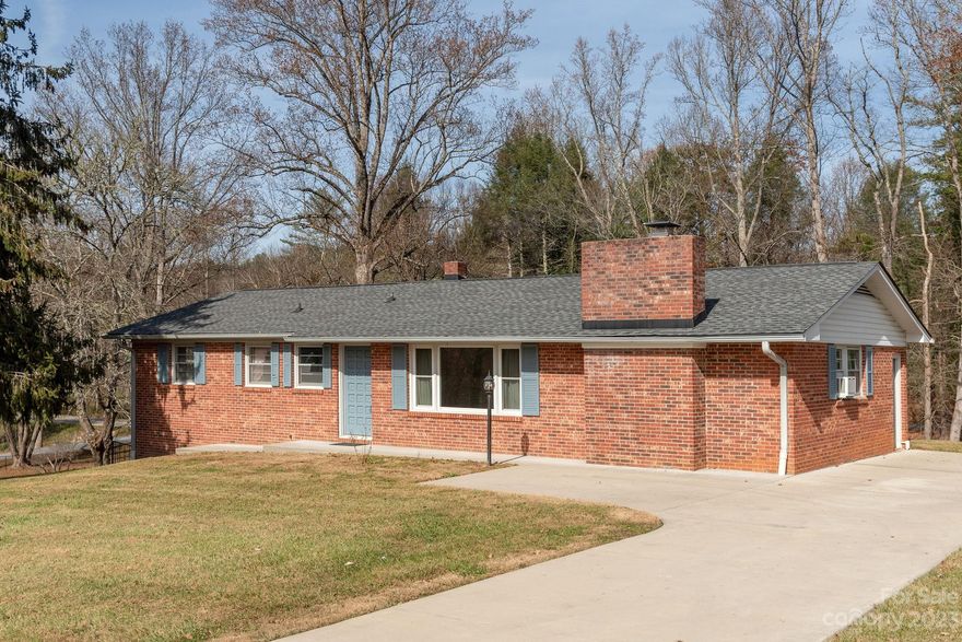 Brick Ranch in small/established sub/div on beaut .61Ac lot w/fantastic location-aprx.4 mi. to historical d/town Hendersonville(shopping,medical facilities,groceries,etc.)+convenient to Asheville Reg.Airport & Brevard.3 BdRms, 1&1/2 ba.,LivRm w/lrg.pic window.Step dwn LR to Fam/Rm w/flr-ceil.brick F/Plc(wd/burning).Cozy Kit.w/custom blt.pinewood cabinets,brkfst/bar & din/area w/sliding dr. access to lrg/inviting back yard.  Basement w/lots of storage shelves+work area,washer,dryer connections(w/d incld.but,washer needs new drainage system). Updates  Incl:2023:A.O Smith 50 Gal.Elect.Water Htr. 2019:New Roof w/30 yr.warranty,new dish/washer, waterproofed basement,installed sump pump,concrete sidewalks,exterior steps & upper driveway,blt.closet to enclose wtr.storage tank.2018:Installed new gar/dr.opener.2017:new electric panel box.Seller thinks?Hardwd.flrs.under carpet in LR,Bdrms & maybe?din area.Curb Appeal Galore!Needs Updates-could be doll house!SOLD AS IS, Seller to make no repairs.