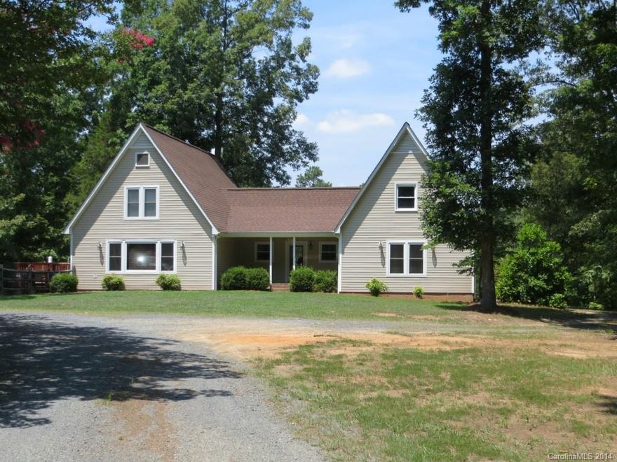 Beautiful home set on 6.9 acres. Updated kitchen features granite counter tops, mobile granite island/breakfast bar, stainless appliances.  Hardwood floors, Sunroom on main level off of foyer. Master bedroom on main level with great closet space and tiled shower. Great office space. Upstairs has 2 bedrooms and full bath with a spiral stairway to additional storage space. Bonus room located over garage. Dual HVAC unit,  Large fenced yard, 2 decks, 2 car attached garage plus an oversize 1 car workshop.