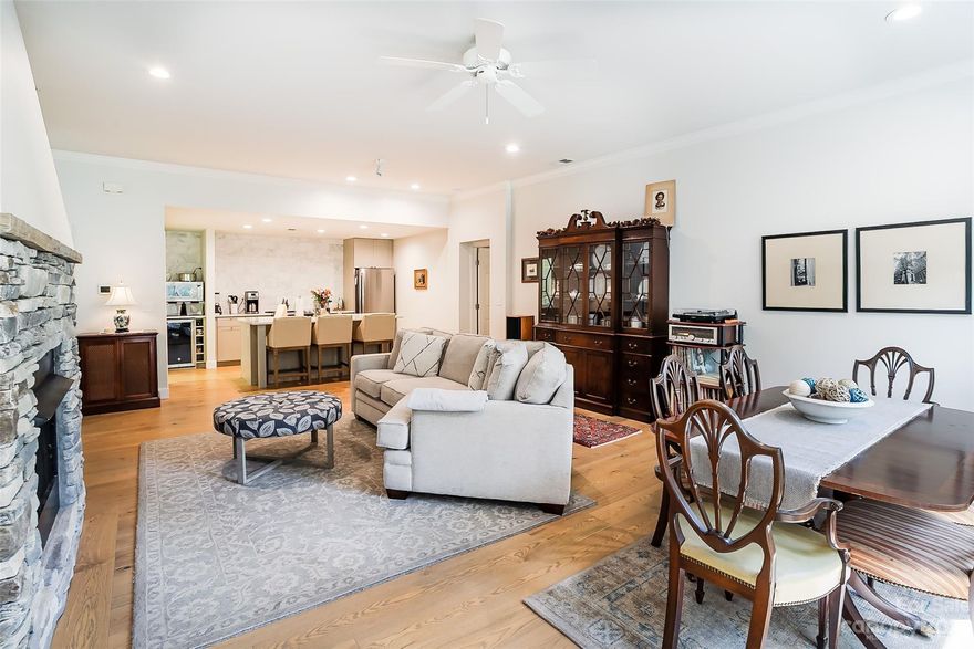 Immaculately maintained and stylish end-unit condo in Straus Park with private garage, screened porch, and completely level entry and layout.  This unique unit has been beautifully updated and features two bedrooms and two full baths with upscale kitchen, upgraded bathrooms, private screened-in porch overlooking wooded green area, stone fireplace (natural gas) and so much more.  Discover upscale finishes, ample light and one level living at its best.  Located in the highly-coveted community of Straus Park, you will enjoy neighborhood amenities like pool, club house, lake, tennis and pickleball courts, community garden and walking trails all within the city limits of Brevard, N.C.