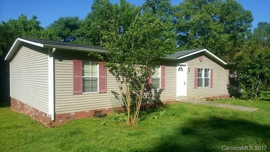 Large Doublewide home with 4 BR/2 BA, living room, den, large eat-in kitchen, large yard. Very convenient to town! House has Heat Pump for heating and cooling, gas log fireplace, Parkay wood flooring and large Master Suite.