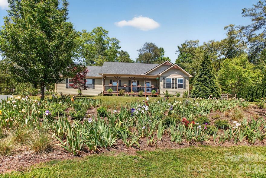 This well maintained and updated 3BR/2BA home offers a spacious open floor plan with attached 2 car garage. Inside you'll find new LVP flooring, granite countertops, stainless steel appliances, vaulted ceilings and gas fireplace, all on one level. The spacious primary suite has vaulted ceilings, a walk in closet and bath. Two additional bedrooms with a shared bath are on the other side of the home. French doors lead from the living area to a screened in porch. Outside you'll find a covered front porch with mountain and garden views, a large composite deck in the back with a fenced in yard and beautiful gardens and trees for privacy. Home is situated at the top of a cul-de-sac in a peaceful neighborhood. Golf course, waterfalls, and hiking trails nearby in national forests.

 HOA road maintenance fee set to be cut in half in 2027. Road repaving set to begin Spring 2026.