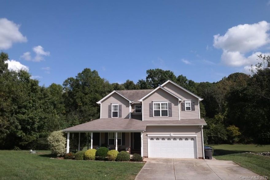 Pottery barn perfect!  Have a seat on the covered porch, sip some tea.  This custom home is located on an acre lot that backs up to woods.  Open flowing floorplan, two story great room, updated kitchen with new stainless steel appliances, granite and tiled backsplash.  Upstairs you will find a roomy master suite and two guest rooms.  Outback you will find a fire pit, a garden, horseshoes and room for a pool.