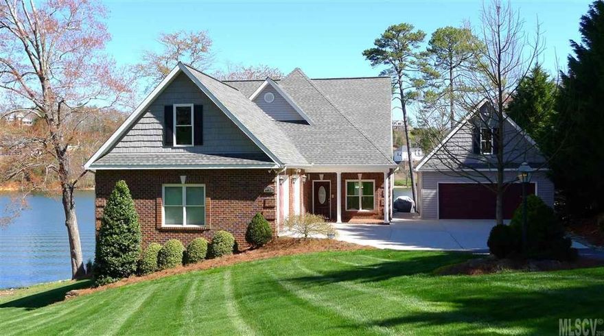 Enjoy panoramic views of Lake Hickory from all three levels of this meticulously maintained home in NW Hickory. Surrounded by professional landscaping and a lush green lawn, this custom home features a main channel location, salt water pool, covered dock with boat lift & party deck, & garage space for six vehicles! The main level offers a formal dining room, office, & great room with gas fireplace & views of the lake. The open kitchen features custom cabinetry, granite counters, & gas range with pot filler. You'll also find a master bedroom on the main level, offering a large walk-in closet & private bath with double vanity, jetted tub, & separate shower. Upstairs, you'll find two bedrooms sharing a Jack & Jill bath, plus a bonus room with half bath. The full lower level was made for entertaining, featuring a large den & full kitchen just off the pool patio. Two bedrooms, a full bath, half bath, storage closets complete the lower level. Detached double garage with efficiency apartment.