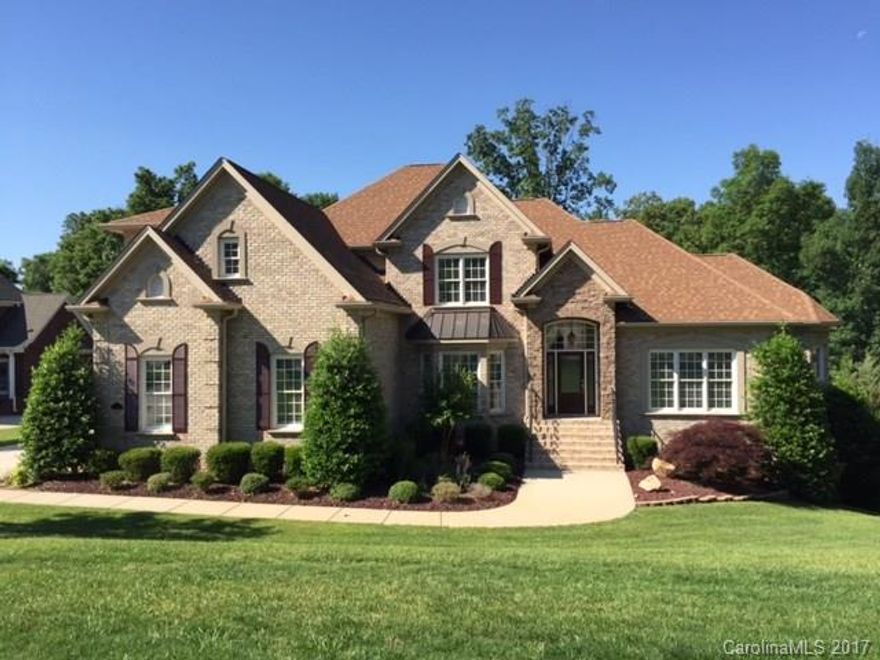 MOVE IN READY at a New Lower Price!! Like new, stunning custom home perfect for in-law/blended family;Home has exceptional amt of natural light, 2 Story Great Rm w/ FP & builtins;ALL new paint & new upgraded carpet; 2 decks, one screened in; Walk out basement has own entrance, FP and full bath;3 HVAC units to heat/cool each level independently;Many rooms/deck/garage wired for speakers:Landscaped garden & terraced hardscape for veg garden. Check out virtual tour for more photos!