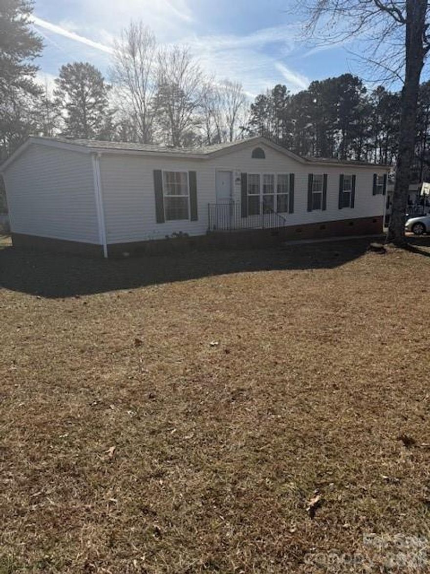 New Price Improvement !!Country Living on almost half acre --No City taxes- 
Great Mooresville Schools
Spacious Mobile Home in Ashley Woods --Recently Updated with Laminate Wood Flooring 
throughout Open Great Room -DR & Kitchen w/ Island - Separate Laundry Room has Laundry Sink
Plus Water Softener Included !!
Split floor plan with Master Bedroom & nice size two other bedrooms 
Mas Bath has a jacuzzi tub/Separate shower -Double bowl  vanity -Master walk-in Closet
Backyard has a Nice White Wooden deck for Grilling & enjoying a large flat back yard -
Outside Storage Shed 
Appliances included stated per MLS electric range-dishwasher--
"Refrigerator is Negotiable with Acceptable offer"
 Minutes from historical downtown Mooresville --Close to Shopping-& Freeways!