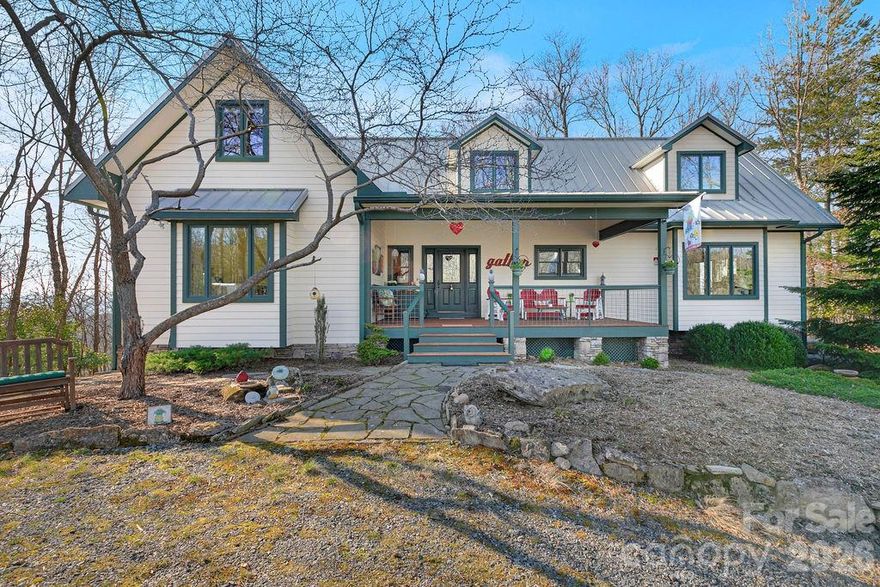 CHECK OUT THE VIDEO -- Welcome to 40 Walnut Ridge Circle, a custom-built mountain retreat offering 3 bedrooms and 3 baths on nearly 5 acres of private, wooded land at the top of Walnut Ridge in the sought-after Eagle Lake community. This exceptional home combines quality craftsmanship, natural beauty, and thoughtful design in a peaceful, elevated setting.

Step inside to a stunning great room with cathedral ceilings and floor-to-ceiling windows, filling the space with natural light and showcasing the surrounding landscape. A stone fireplace creates a warm focal point, perfect for cozy evenings. The home features Australian cypress flooring, custom cherry cabinetry in the kitchen and primary suite, and maple cabinetry throughout the rest of the home, highlighting the attention to detail and high-end finishes.

The layout is designed with privacy in mind, offering comfortable separation for guests and family. The upper level includes a spacious family room along with a bonus office/den or additional guest space, providing flexibility for a variety of needs.

The lower level is a true standout, featuring a woodworker’s dream workshop—fully outfitted and available for purchase with tools and equipment—along with a separate garage for additional storage or workspace.

Located within the Eagle Lake community, residents enjoy access to a 32-acre private lake, ideal for swimming, fishing, boating and beach access, all while being just minutes from downtown Brevard, DuPont State Forest, Pisgah National Forest, and a short drive to the Asheville Regional Airport.

With its combination of privacy, craftsmanship, and access to both nature and community amenities, 40 Walnut Ridge Circle offers a rare opportunity to experience the best of mountain living.