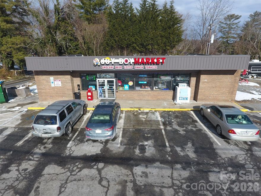 Prime Commercial Investment Opportunity – Hendersonville, NC
Located at 2020 Asheville Highway, this fully remodeled convenience store building presents a strong, turn-key investment opportunity along one of Hendersonville’s busiest commercial corridors. 
The property was completely remodeled following fire damage in 2021 and now features all new three-phase electrical, new HVAC systems, new roof, windows, flooring, and extensive interior and exterior upgrades—offering investors a modernized asset with major capital improvements already in place.

The primary building is currently leased under a triple-net (NNN) lease, providing immediate income with minimal landlord responsibility.

The adjoining parcel is included in the sale and adds significant value and flexibility. This lot is equipped with its own 200-amp electrical service, including 110V, 30A, and 50A receptacles, specifically designed for food truck operations, as well as a city water connection. The lot is presently leased on a month-to-month basis to a food truck, offering both current income and future redevelopment or expansion potential.

Strategically positioned on heavily traveled Asheville Highway and surrounded by well established businesses including Ingles Markets, Pelican’s SnoBalls, Monte’s Subs, Bay Breeze Seafood, and Moe’s Original BBQ. The property benefits from excellent visibility, strong traffic counts, and consistent consumer demand.

This is a rare opportunity to acquire a stabilized, income-producing commercial property with additional upside in a high exposure location.
Call the listing agent for additional details and lease terms.