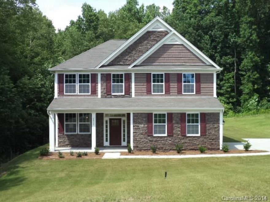 House sits on .75 of an acre and backs up to trees. Yard can easily accommodate a pool.