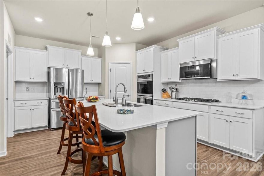 Experience refined living in this exceptional 3-bedroom, 3-bath luxury home located within a sought-after community in the rapidly growing area of Tega Cay. Designed for both elegance and ease, this home offers a thoughtfully crafted open floor plan ideal for entertaining and everyday comfort. Enjoy the spacious loft for entertain or relaxing. Crafted with automatic shades controlled with just a push of a button. 

The expansive gourmet kitchen serves as the centerpiece of the home, showcasing sleek, upscale finishes, abundant cabinetry, a large Island, and a double oven—perfect for hosting gatherings or preparing meals with ease. Adjacent to the kitchen, a private dining room provides an inviting setting for formal dinners and special occasions.

Unwind in the spacious living area, enhanced with built-ins and a cozy fireplace. The home extends seamlessly into a screened-in sunroom, creating a tranquil space to enjoy morning coffee, evening relaxation, or year-round indoor-outdoor living.

The luxurious primary suite is a true retreat, featuring a beautiful en-suite bathroom with a large walk-in shower, premium finishes, and a generous walk-in closet designed for both style and function. Additional bedrooms and bathrooms provide flexibility for guests, hobbies, or a home office.

Enjoy luxury living all while being conveniently located near shopping, dining, recreation, and the continued growth and energy of Tega Cay. Low-maintenance, upscale design, and an exceptional location is what makes this home a standout opportunity.