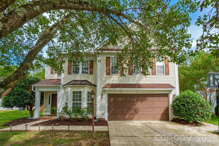 Spacious 4-bedroom, 2.5-bath home featuring an attached garage, bright open living areas, and a cozy fireplace. The kitchen offers stainless steel appliances, ample cabinet space, and overlooks the main living area, making it ideal for entertaining. Large windows throughout provide abundant natural light, while the primary suite includes generous space and a private bath. Additional highlights include a separate dining area, laundry room, neutral finishes, and a beautifully landscaped exterior with mature trees.