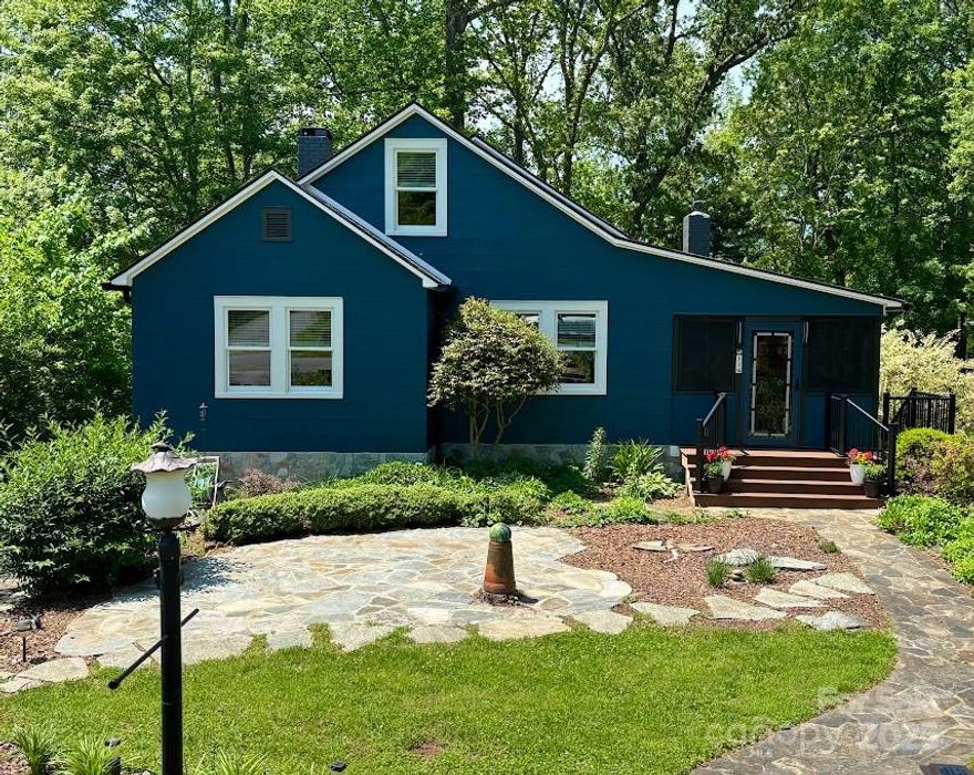 Location, charm, and truly move-in ready! This classic cottage bungalow in Downtown Tryon checks all the boxes! Walk or golf cart to local restaurants and shopping. 4 bedrooms, 2 full baths, kitchen with induction cooktop, convection oven, custom cabinetry and stainless steel appliances. Updated interior finishes, hardwood floors and even a built-in Murphy bed - use that bedroom as a flex space! Gorgeous landscaping and stone walls with front and rear flagstone patios. Large private back yard and a potting shed with water and electricity. City water and sewer, natural gas and fast internet. One of the very best neighborhoods in Tryon! Updates include roof, gutters, whole house generator, Anderson windows, fenced dog yard with access from the house. This owner has thought of everything!