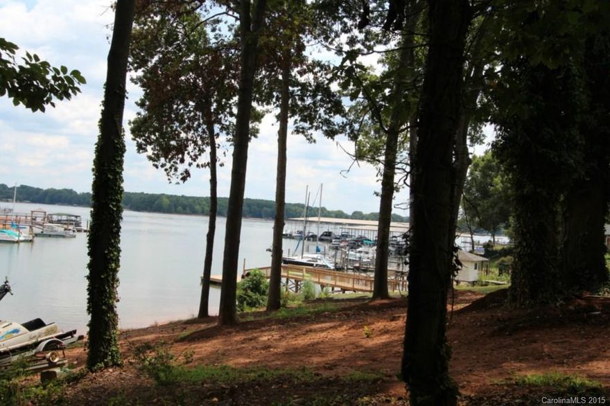 Hurry on this one, FANTASTIC price for a main channel view and private dock lot! Waterfront lot on Brawley School Peninsula with main channel view. Gentle slope to the water. Great water depth for your dock, swimming and playing. Meets all requirements for private pier or dock. Already perked, septic permit on file. Bring your own builder, no time limit to build, no HOA dues. Community marina and boat ramp for exclusive use of the community land owners. Great opportunity to own a piece of LKN!