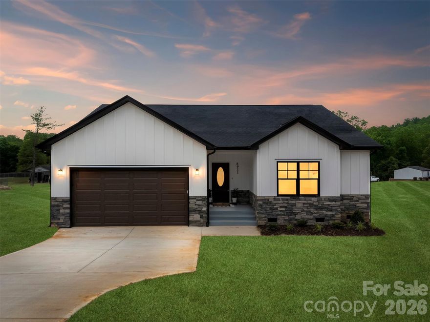 Experience the perfect blend of modern luxury and country serenity in this stunning new construction ranch situated on a rare 2-acre homesite. Boasting an expansive open-concept layout, the heart of the home features a massive Great Room and Kitchen area with soaring vaulted ceilings, perfect for entertaining or quiet evenings in. The chef-inspired kitchen offers a large center island and flows seamlessly into the vaulted dining area.

Retreat to the private Master Suite featuring 9' ceilings, a dual-vanity bath, and a spacious walk-in closet. Two additional bright bedrooms provide ample space for family, guests, or a home office. Enjoy the outdoors from your oversized covered rear deck, overlooking a sprawling backyard with endless possibilities for gardening, hobbies, or recreation. Functional upgrades include a dedicated Drop Area mudroom, a separate laundry room, and a 2-car garage. No HOA and plenty of room to breathe!