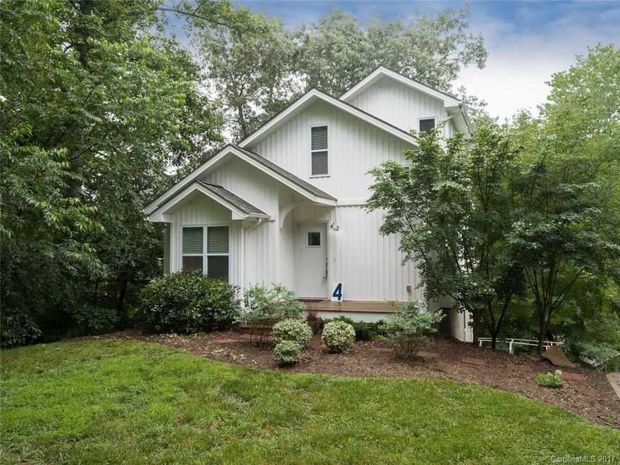 Quintessential newer home in Kenilworth. Discover this 3 level home w/modern touches including cork & concrete flooring, sleek cabinetry, skylights, and master suites on all levels! A Ross Chapin Architect design, you will love the tree house feel as you step out onto the two decks. Add built-ins great for storage & display plus open floorplan, and this home checks all the boxes. Kenilworth location puts you close to downtown, Biltmore, Tunnel Rd, and Kenilworth Park. LOT 2 of attached survey