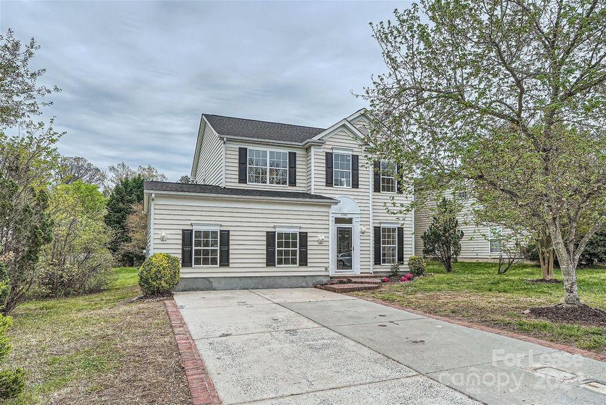 Step into this newly remodeled and move-in-ready home, brimming with updates and abundant natural light! The welcoming living space features a cozy fireplace, seamlessly flowing into the kitchen adorned with fresh countertops, stainless steel appliances, and modern lighting fixtures. Throughout the main level, revel in the fresh ambiance provided by new neutral paint and luxurious vinyl flooring. Upstairs, you'll find generously sized bedrooms, including a spacious primary suite with a sitting area, and walk-in closet. Outside, mature trees grace the expansive backyard, providing a perfect setting for outdoor entertaining. Located conveniently close to schools and shopping, this home offers both comfort and practicality for your lifestyle needs.
