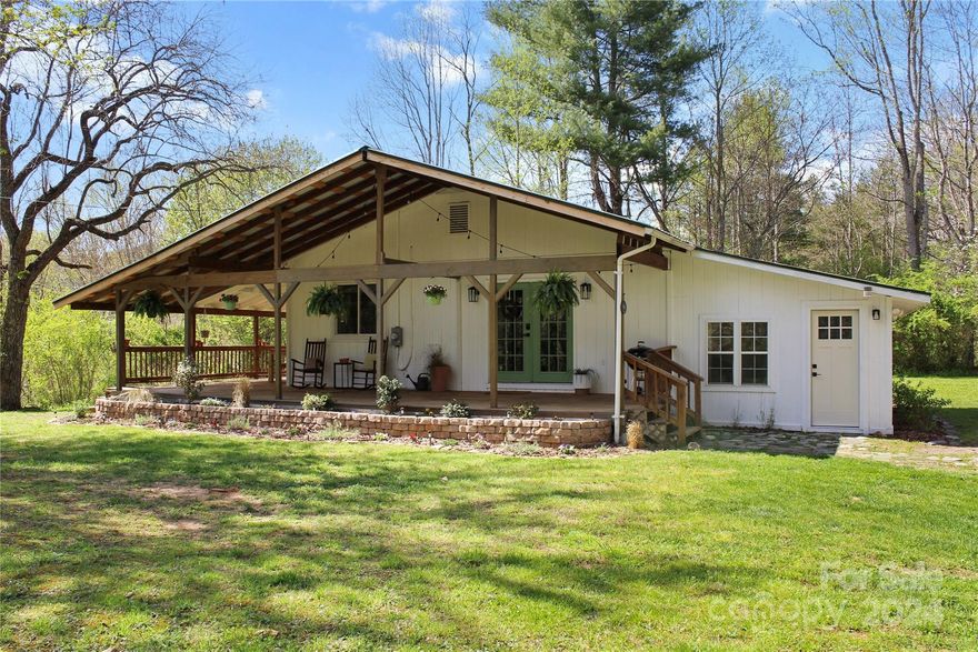 A perfect location, nestled on top of a hill with privacy all around. Step into this stunning, updated 3 bedroom, 2 bath home, a home office, and much more.  Enjoy many hours on the wrap around porch.  This property has an open kitchen/living area with a wood stove - sit by a cozy fire, spend time with family, or read a book.  The 3rd bedroom has a separate entrance, a private bath, and mini-split heating/cooling system.  The unrestricted 1.19 acres offers level, wooded areas to do much outdoor living.  There is even an old chicken coop for the individual looking to live more rustic.  Lie on your hammock in the yard or on the porch enjoy the views and the privacy.  The perfect opportunity to have your own rental for short or long term.  Just minutes to Cherokee, Sylva, and Bryson City. Don't let this property slip away.- the perfect get-away.  If you visit you may just never want to leave. Seller requesting all offer be submitted by 7PM Friday, May 10th.