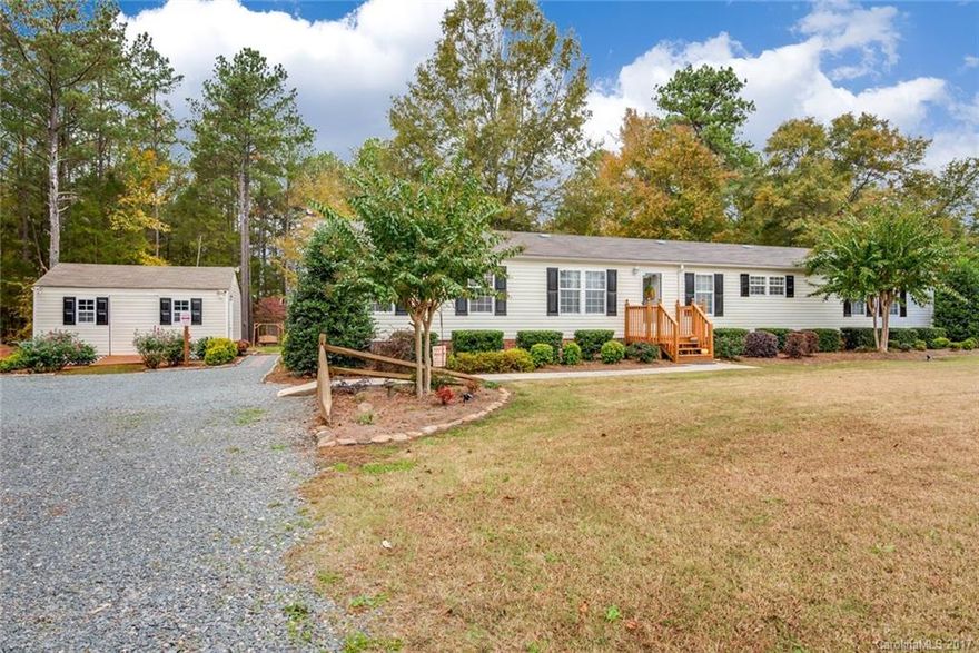 Immaculate home on private, well-manicured lot.  Open floorplan with laminate hardwoods throughout - no carpet!  Family room w/ gas log fireplace; large kitchen w/ breakfast nook, island & ample cabinet space; dining room w/ access to 10x18 deck at back of home. Large laundry rm w/ sink. Master Suite w/ dual vanities, separate garden tub & shower, & walk-in closet. Spacious secondary bedrooms w/ walk-in closets. Backyard features a firepit, playset, & 14x20 storage shed.