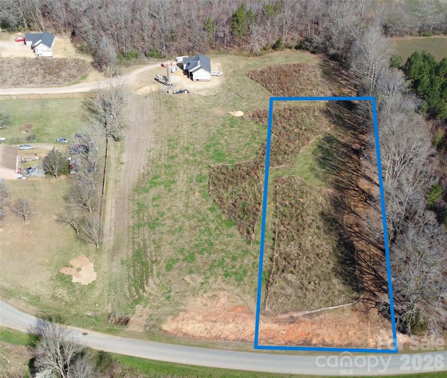 Welcome to your future dream home, currently under construction and set for completion in FALL 2026. Nestled on just over 1 private acre in a serene country setting, this modern residence offers the perfect blend of open-concept living, stylish design, and the tranquility of wide-open spaces. A charming front porch welcomes you home—perfect for rocking chairs, swings, and quiet evenings enjoying the breeze and country scenery. Step inside to an inviting open floor plan that seamlessly connects the kitchen, dining, and living areas—ideal for entertaining, gathering, or simply enjoying everyday life. One of the most exciting opportunities this home offers is the ability for the future homeowner to personalize finishes and selections. There is still time to choose your favorites from the builder’s trusted local vendors—allowing you to tailor the spaces with the flooring, cabinetry, fixtures, Siding, and colors that best reflect your style. In the back, a spacious 12x12 porch offers even more room to unwind, entertain, or enjoy outdoor dining while overlooking your peaceful acreage. Set on 3 expansive acres, this property provides endless possibilities for outdoor living, gardening, or simply enjoying the quiet of country life. Whether you envision a modern farmhouse aesthetic or a contemporary retreat, this home is designed to grow with your vision. Photo and Floorplan are proposed, and are representations. Have a different floorplan in mind, we have other lots avaible! Builder is fully custom, if you need a modification to the floorplan, don't be afraid to ask.