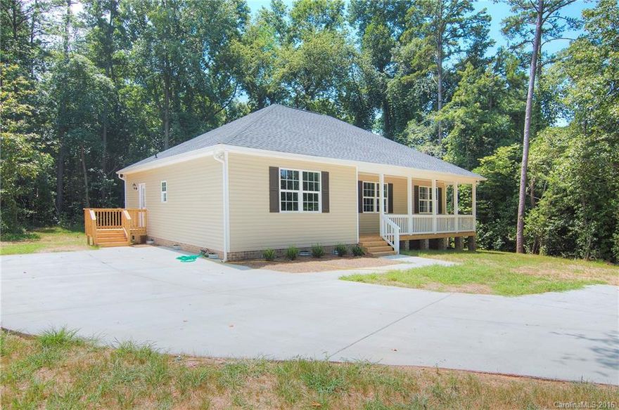 NEW NEW NEW construction under $200K. Beautifully appointed home nestled in large .49 acre wooded lot. Wonderfully functional split bedroom ranch.  Loads of natural light in vaulted great room.  Kitchen with granite counters, stainless appliances, & large pantry. Spacious master suite with custom trimmed tray ceiling, ceiling fan & huge walk in closet. Master bath with granite counters, double sink vanity & tile floors. Laundry room with side entry door to driveway. Deck and covered front porch!