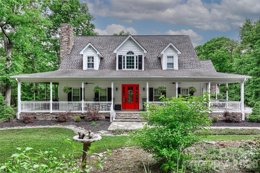 Be ready to be wowed by this stunning farmhouse estate situated on almost 5 private acres, conveniently located just minutes from the city, Mountain Island Lake, shopping, and restaurants. This ideal location offers the perfect blend of privacy and accessibility. Beyond the entrance, you’ll find pure tranquility with a thoughtfully designed layout featuring a spacious primary suite on the main level, inviting living spaces, a screened porch, and a wraparound rocking chair front porch all designed to create the most peaceful setting imaginable. The large chef’s kitchen is perfect for gathering and entertaining, while the gardening areas and expansive outdoor spaces make everyday living feel like a retreat. Entertaining is effortless with the home’s seamless indoor and outdoor flow.
The upper level features two large guest bedrooms with a full bath, while just beyond the kitchen you’ll find a spacious bonus room offering endless possibilities for a media room, playroom, home office, or additional entertaining space. This is a rare opportunity to own significant acreage while still being close to everything the city of Charlotte and the lake lifestyle have to offer.