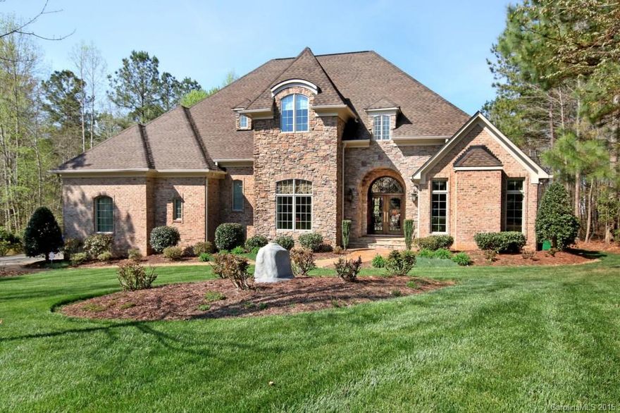 Gorgeous custom home in pristine condition! Stunning entry opens to a two story foyer w/ a winding staircase. Gourmet Kitchen w/granite counters & sinks, 6 burner gas cook-top, double ovens, mahogany cabinets. Great Room w/ built-in cabs, gas log fireplace w/french doors to porch and wooded views. Deluxe Master Suite on main level, huge walk-in closet w/dressing room & luxurious bath w/whirlpool tub. Main level boasts media room, office & workroom/craft room. One year 2-10 Homebuyers Warranty.