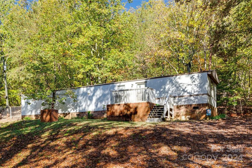 Excellent investment opportunity! If you are looking for privacy and woods at a great price, you have found it. Home sits on almost 1.5 acres of woods. Home was a rental property for 17 years. All systems are in good working order according to the seller. Last tenant was paying $650/month. Home may need to be detitled prior to getting a loan. Johannesmeyer and Sawyer can handle well within any closing period.  This is a great opportunity to own a piece of land in an awesome school district and perfect location. Home will be sold as-is. No repairs to be completed by seller.